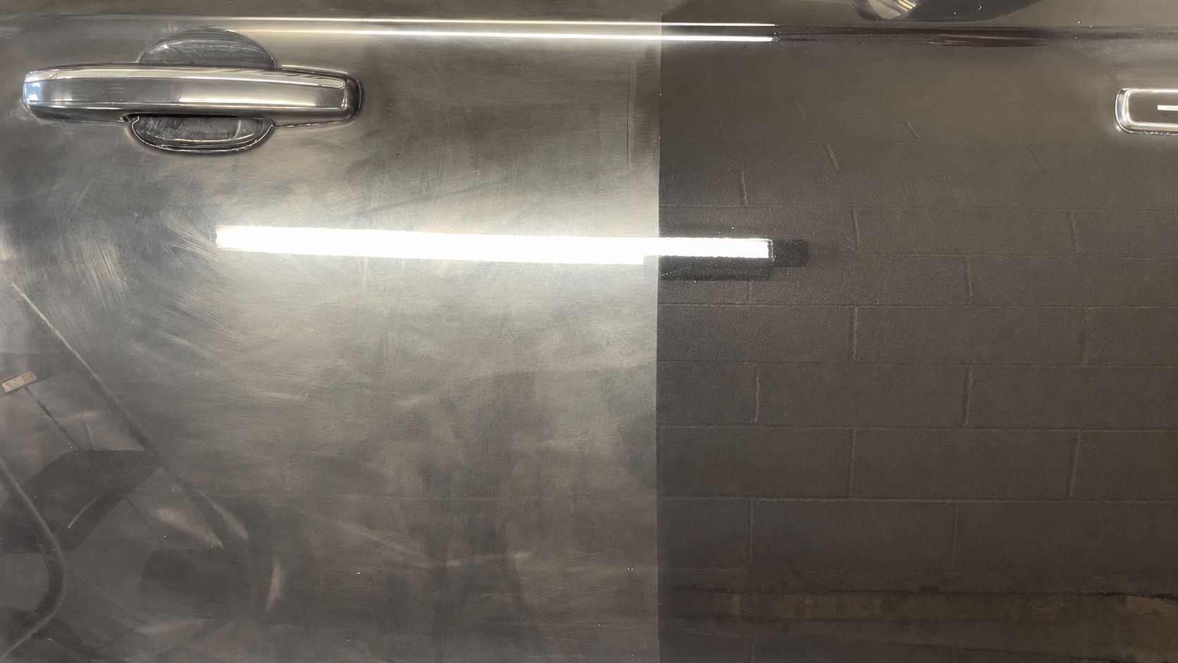 Dark car door polished on one half: swirled and hazy on the left, clear and reflective on the right