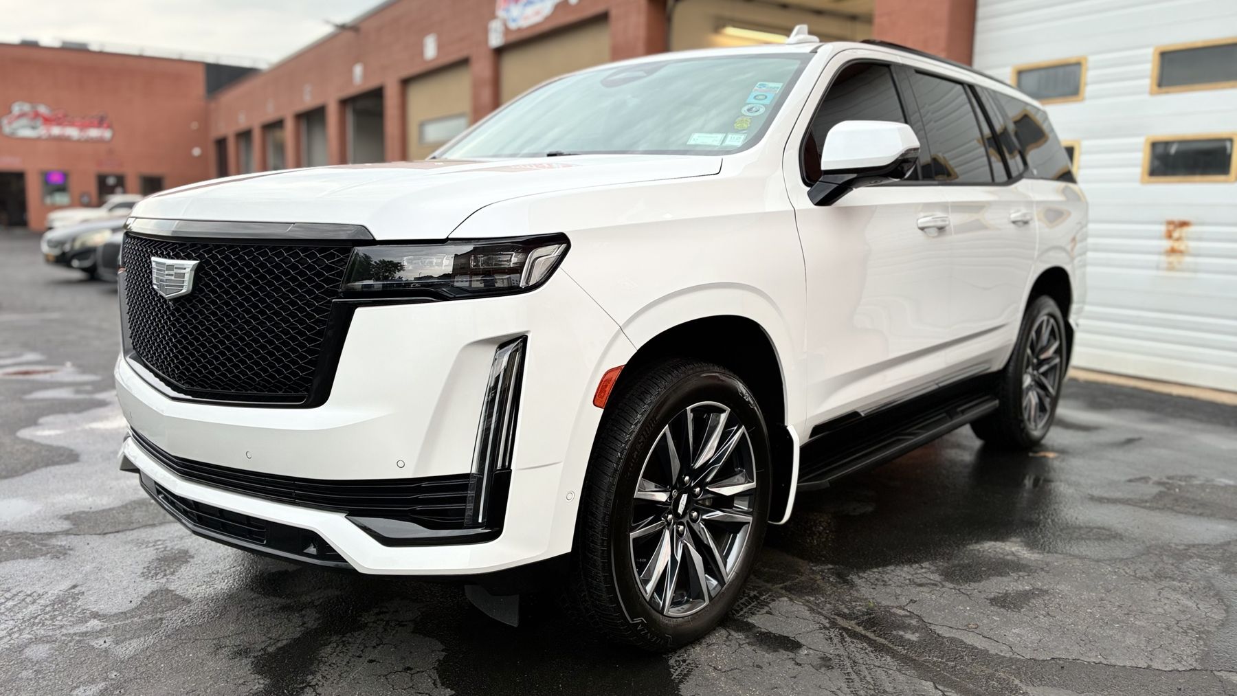 White Cadillac Escalade with freshly detailed glossy paint